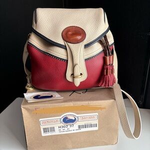 Dooney and Bourke awl leather Teton Drawstring Bag 
Rouge Bone Navy